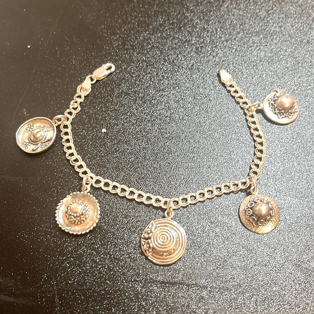 Charm bracelet. Sterling with 5 hat charms